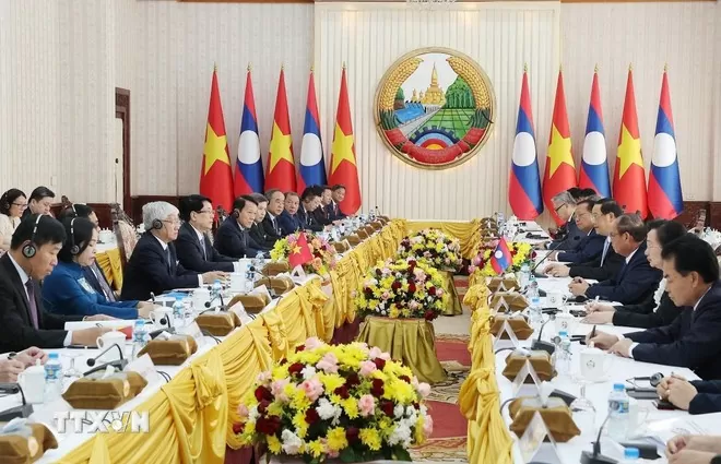 Chủ tịch nước Lương Cường hội kiến Thủ tướng Chính phủ Lào Sonexay Siphandone. Ảnh: TTXVN